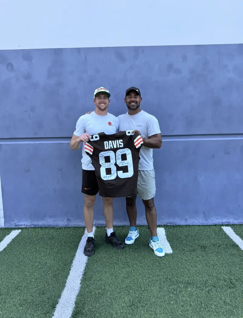 Craig LeBlanc with Kaden Davis holding a signed Davis number 89 jersey
